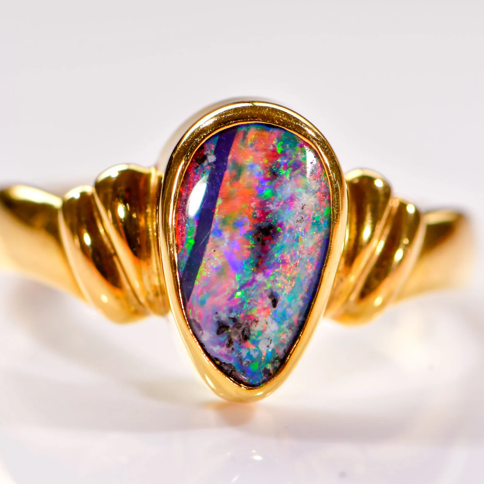 Rainbow Gem Boulder Opal set in 18k Yellow Gold